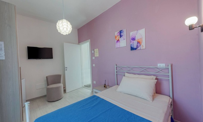 Squinzano Apartment | Room 'Lazzarella' with Shared Terrace, Wi-Fi and Air Conditioning