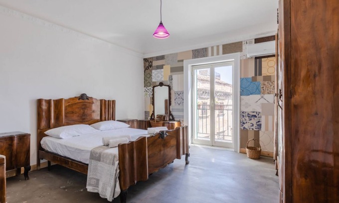 Albergheria Apartment | Roomy apartment of about 110 sqm, with characteristic finishes, able to accommodate up to 10 people, located on the third floor of a renovated building (NO lift). The property is located in the center of Palermo, in a Restricted-Traffic Area, a short dis