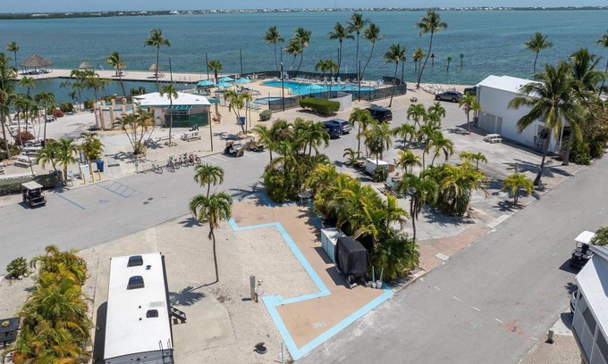 Cudjoe Key RV Rental | RV Lot 301 Venture Out, Pull-through Lot near the Ocean and Pool - Golf cart friendly!
