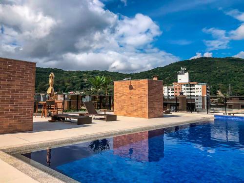 Corrego Grande Apartment | Sapphire Studios: Conforto no Córrego Grande P528