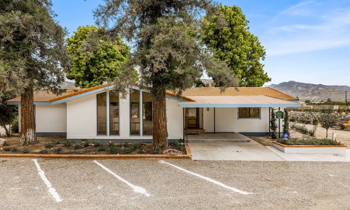Fillmore House | Single-level home surrounded by lush gardens with a washer/dryer, AC, & wet bar