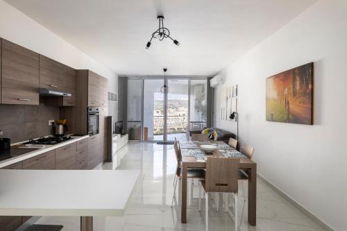 Marsalforn Apartment | Spacious 3BD Apartment with Country Views & Large Front Terrace with Outside Furniture