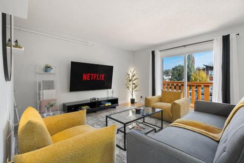 Montgomery House | Spacious 4-Bedroom Retreat Near Bow River with Foosball, Dart Board, Movie Room