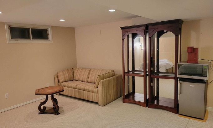Saint-Laurent House | Spacious basement with indoor garage