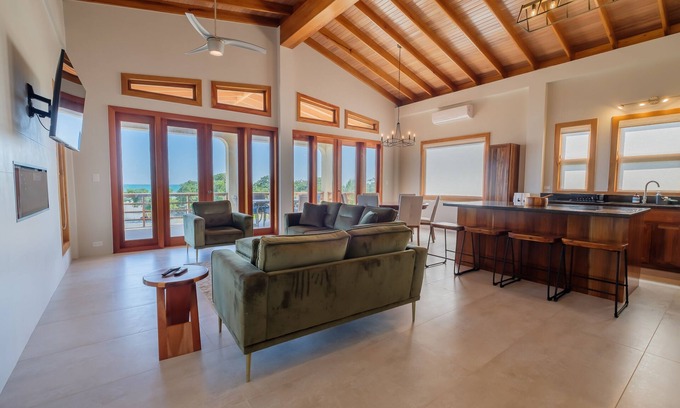 Caye Caulker Apartment | Spacious beachfront retreat with a soaking tub - pool, canoes, dock, & grill