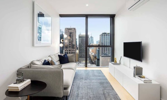 Melbourne Central Business District Apartment | Spacious Collins St Apartment with City View + Gym