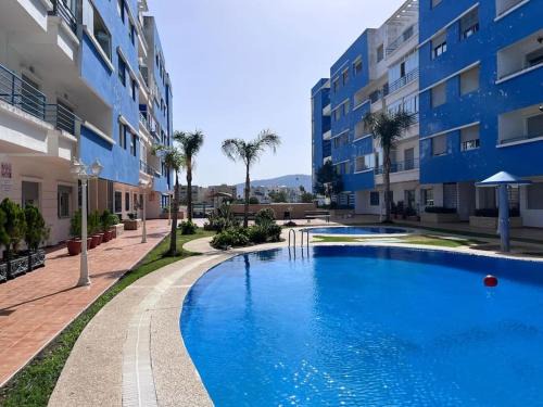 Martil Apartment | Spacious Family Apartment in Martil - Air Conditioning, Pool & Garden Views