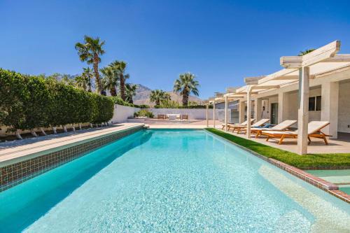 Racquet Club Estates Apartment | Spacious home with pool, fireplace, outdoor deck