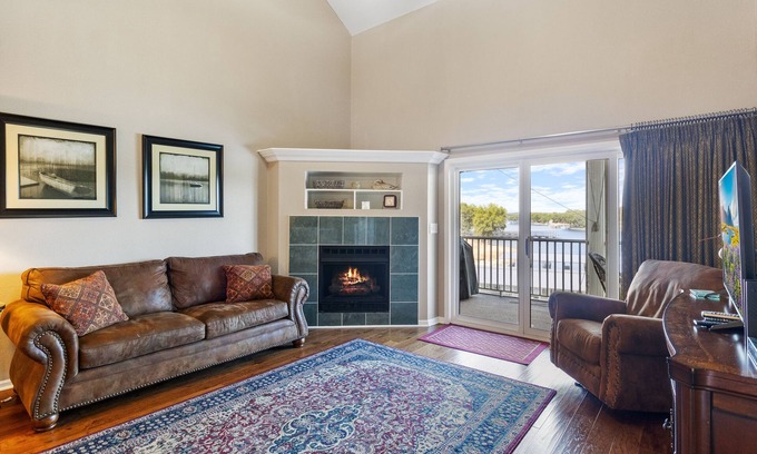 Sunrise Beach Condo | Spacious Lakeview Penthouse with Screened Balcony, Pool, Boat Slip & Lake Access