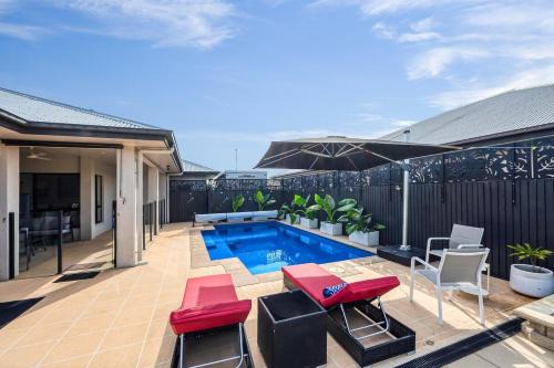 Burdell House | Spacious Townsville Retreat with Heated Pool