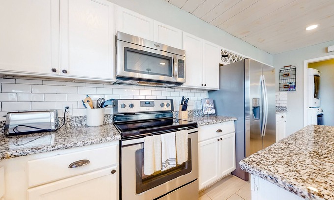 Isla Del Sol House | Spacious upgraded coastal getaway with firepit - near boat ramp, stroll to beach
