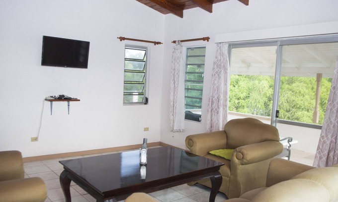 Dickenson Bay Villa | Spacious villa in mature gardens, near beaches, shops and reputable schools.