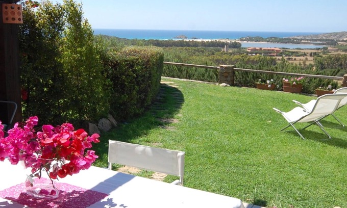 Chia Villa | Spectacular sea view of the entire bay of Su Giudeu. King size bed +topper