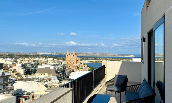 Mellieħa Heights Apartment | Step inside to discover a modern and elegantly decorated space, featuring two spacious bedrooms with ample storage, ensuring a restful and convenient stay. The open-plan living area boasts contemporary furnishings, providing a chic and cozy atmospher