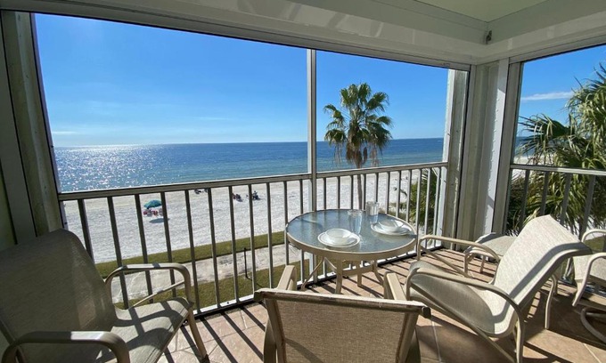 Mid Island House | Strandview #304 - Beachfront condo with screened-in patio and amazing view!