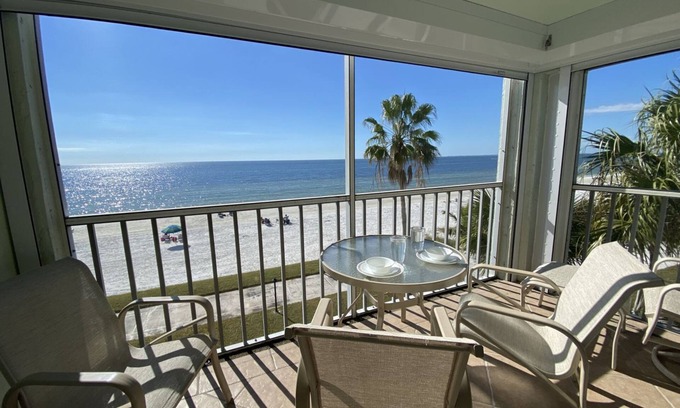 Mid Island Condo | Strandview #304 - Beachfront condo with screened-in patio and amazing view!