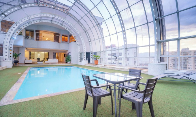 El Poblado House | Stunning 9-BR PH with Spa, Concierge, Breakfast & WiFi in Medellín
