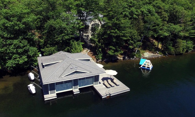 Muskoka Lakes Villa | Stunning Cottage on Lake Joe! 6 bdrm,6 bath,2 slip boathouse! Water Toys Galore!