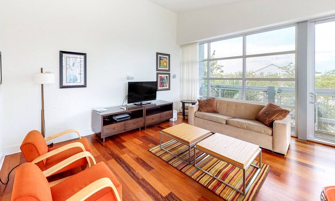 Port St. Joe Condo | Stylish coastal condo w/ shared pool, floor-to-ceiling windows & free WiFi