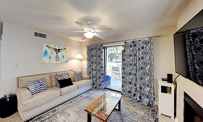 Arcadian Shores Condo | Stylish home with oversize deck & updated kitchen - walk to beach, pools, & gym