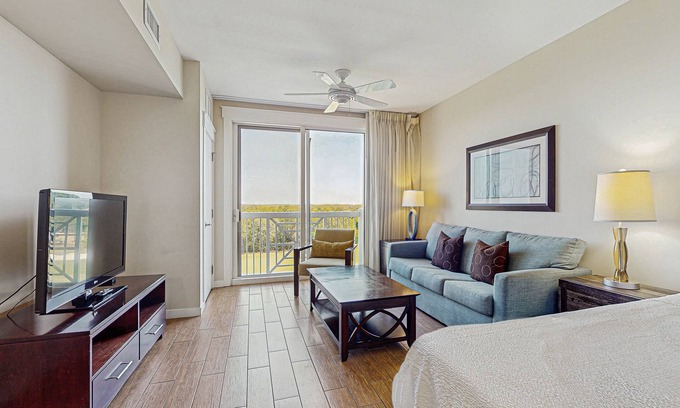 Baytowne Wharf Apartment | Stylish suite with a shared pool/hot tub and golf course/bay views