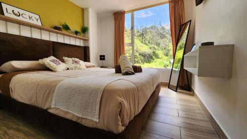 Banos de Agua Santa Apartment | Suites Encanto en Baños de Agua Santa con Jacuzzi y Balcones con Vista a las Montañas