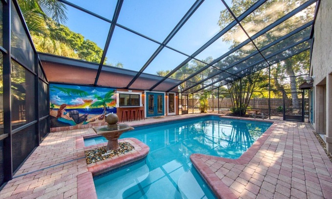 Seminole Villa | The Mermaid House. 5/4 home 1 mi to beach w heated(free) saltwater pool w/lanai