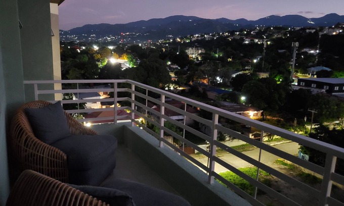 New Kingston Condo | "The Oasis" PH 1 BR with AC, WiFi, complimentary Netflix & 24/7 security.