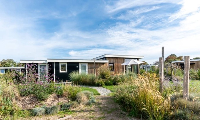 Burgh-Haamstede House | The Scandinavian and Zeeland influences give this chalet a unique style! The beautiful dune garden w