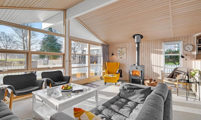 Østerskov House | This beautiful wooden house is located in a smaller cottage area, nestled in beautiful nature.