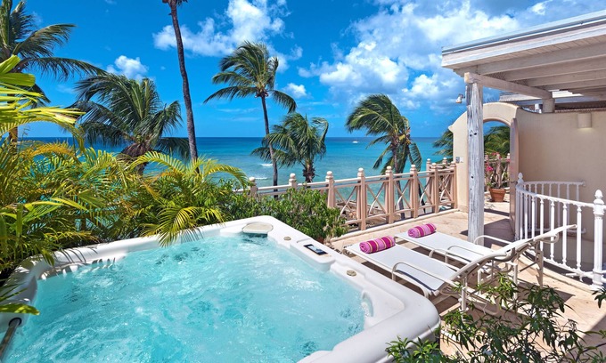 Reeds Bay Condo | This Penthouse is situated directly on a beautiful sandy beach and has a wonderful roof deck terrace