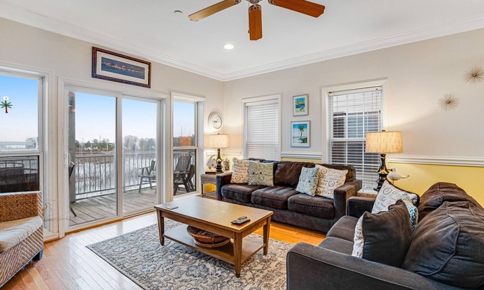 Waters Edge House | Townhouse with marsh & river views - access to crabbing dock & pool