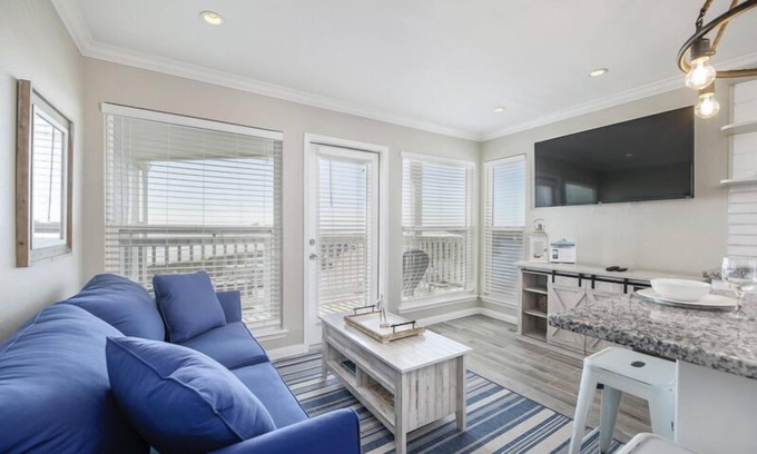 Galveston Condo | Trendy Beach Condo- Sunset views, Sandy Toes, Surfing more. (1304)