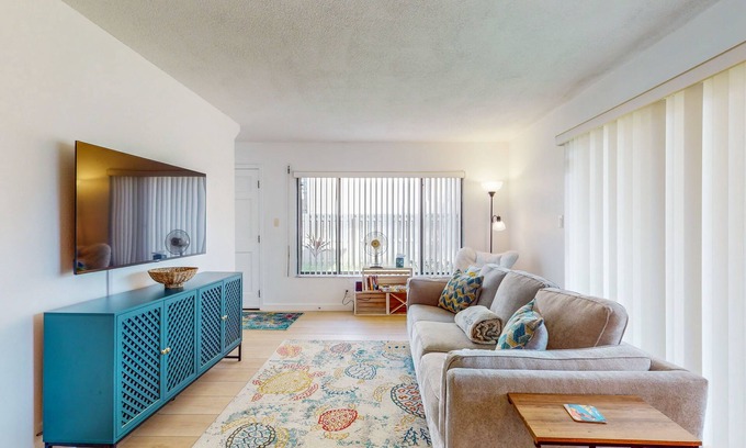 Cocoa Beach Condo | Tropical condo with pool, central AC and private beach access