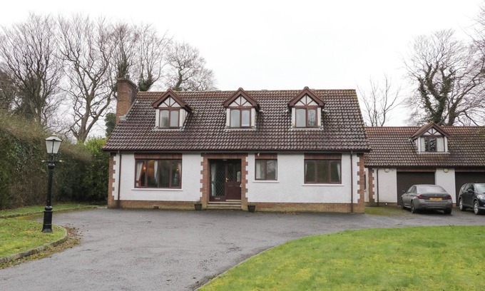 Newcastle Cottage | TUDOR LODGE, pet friendly, with a garden in Newcastle, County Down
