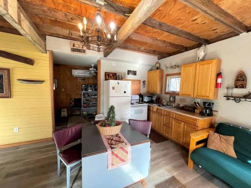 Marble Falls House | Two-Story Cabin Rental for Large Groups along Hamilton Creek in Marble Falls, Texas