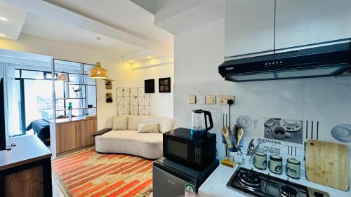 Central Province Apartment | UN approved snug studio with gym