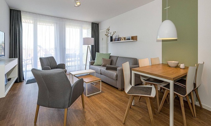 Bensersiel Apartment | Vacation apartment near the North Sea with balcony, parking, use of swimming pool & sauna -
