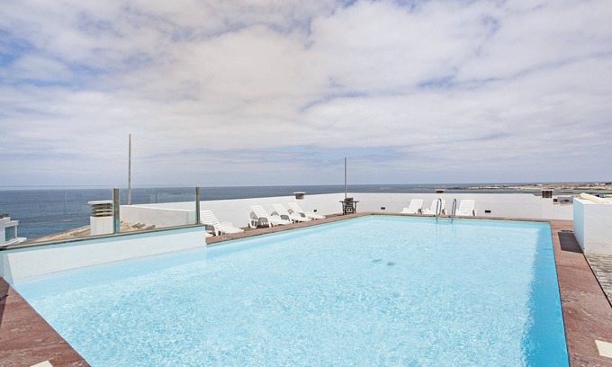 El Cotillo House | Vacation Home 'Apart 3 Dormitorios Vista Mar 4' with Sea View, Shared Pool and Wi-Fi