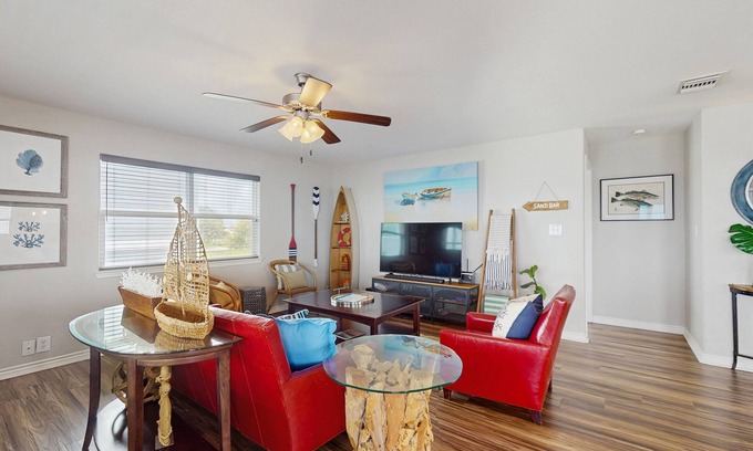 Rockport House | Vibrant bay front home with fenced yard & large decks - steps to sand & fishing