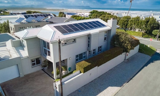 Voelklip Apartment | Villa Armonia | Grotto beach | Large sun deck with pool