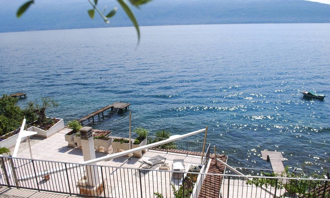 Toscolano Maderno Villa | Villa I Cipressi by Theater Home, directly on the lake with jacuzzi on the terrace