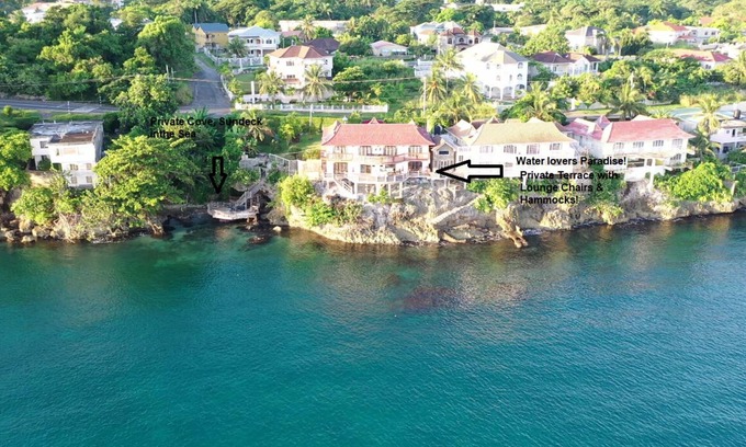 Tower Isle Apartment | Wake up to panoramic ocean views & relax by your own private jetty steps away.n