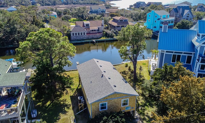 Brigands' Bay House | Waterfront home on a scenic canal with a dock, screened porch & fast WiFi