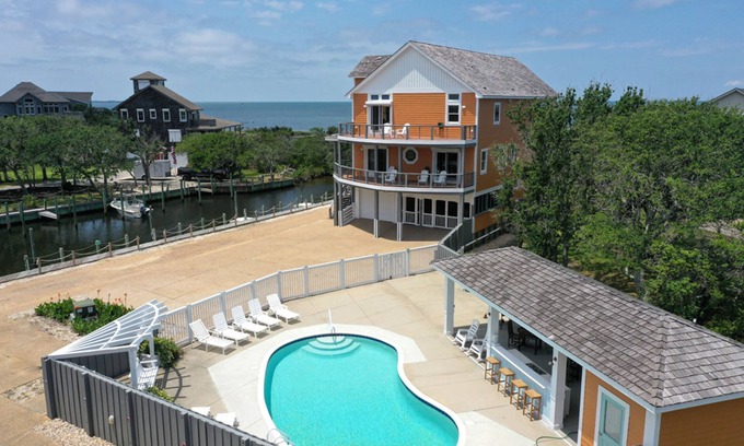 Sunset Village House | Waterfront home with ocean views, private pool, hot tub, & Tesla/EV charger