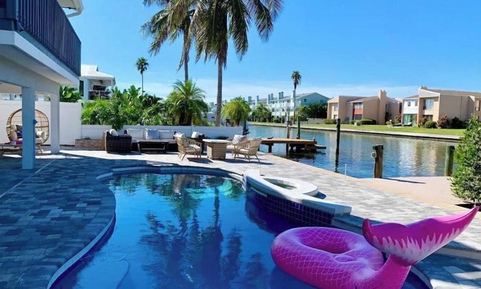 Indian Rocks Beach House | Waterfront Oasis, Heated Pool, Dock, Golf Cart & Chef’s Kitchen