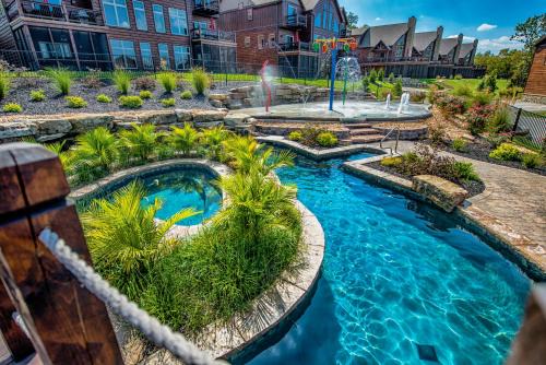 Indian Point House | WaterMill Cove Resort Luxury Lakefront Villa By Silver Dollar City Theatre Room POOL Lazy River