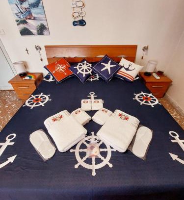 Quartiere XXXIV Lido di Ostia Levante Apartment | WHOLE FLAT CLOSE BEACH BREAKFAST KITCHEN AIR CONDITIONING LAUNDRY SHUTTLE AIRPORT WI-FI CAR PARKING NETFLIX BALCONIES CHECK IN 24H & METRO to ROME