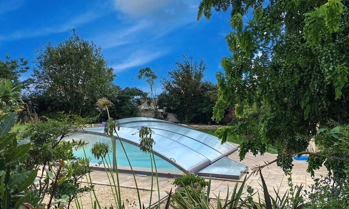 Angles House | With its private swimming pool heated and secured by a dome, family villa
