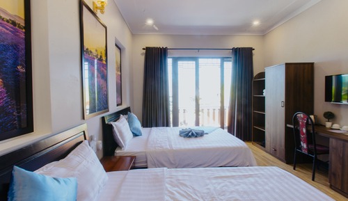 Deluxe Quadruple Room, 2 Queen Beds, Balcony, City View